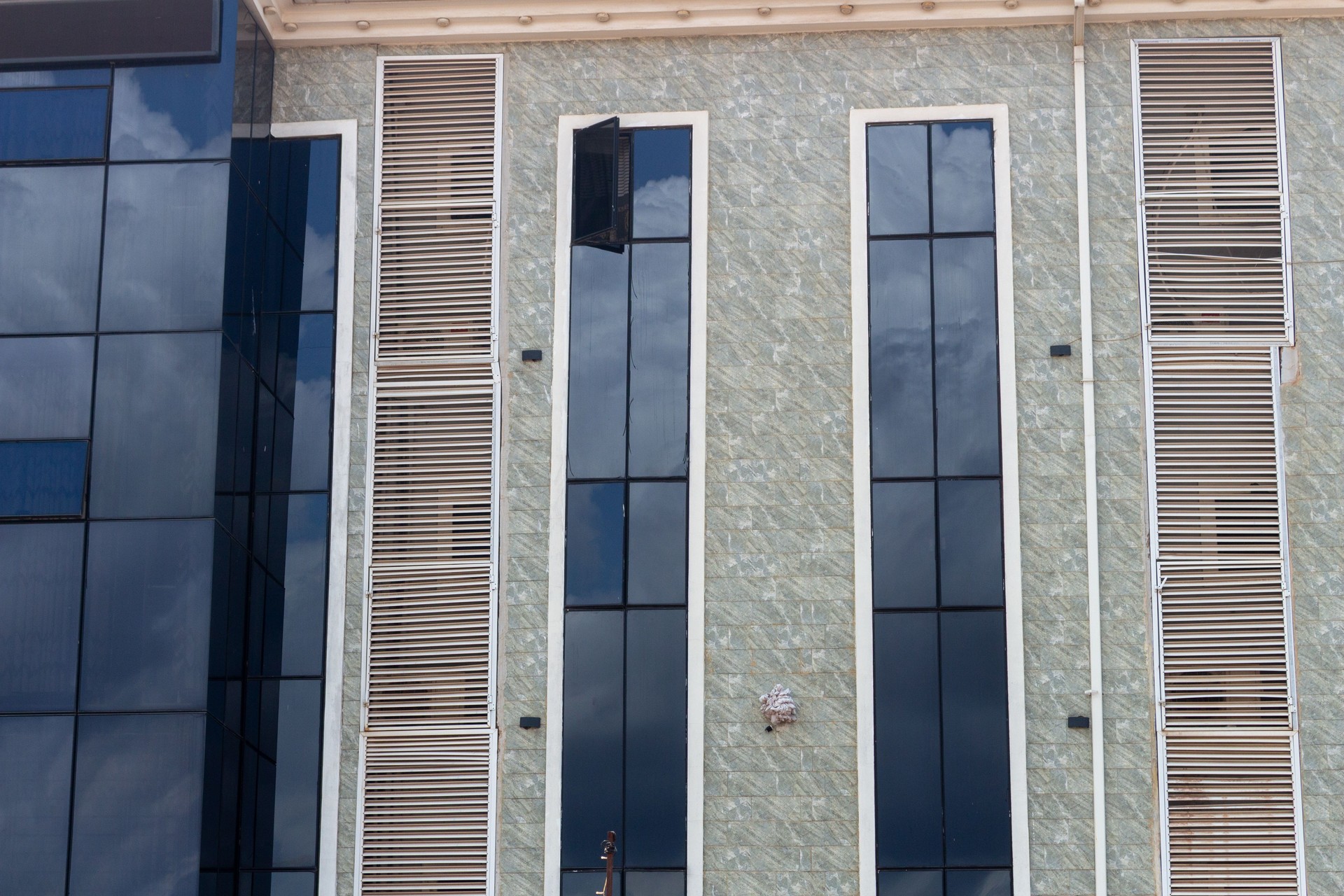 Modern Office Building Facade with Vents and glass panels